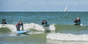 learn wave surfing during a surf camp